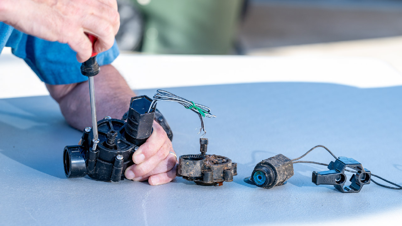 A stock image illustrating replacing solenoid on irrigation valve concepts
